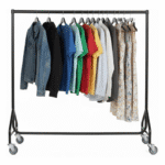 A sturdy 6FT reinforced black heavy-duty clothes rail with 32mm steel tubing and heavy-duty wheels. The rail displays multiple garments on hangers, showing its strong load capacity and sleek modern finish.